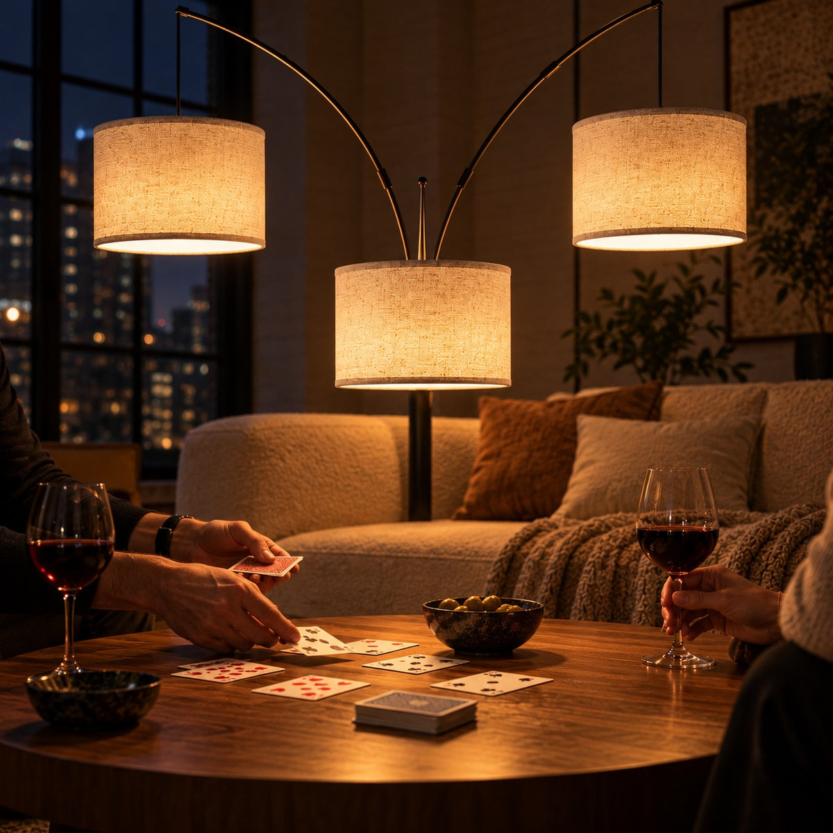 Three-Arm Arc Floor Lamp, switched on at night